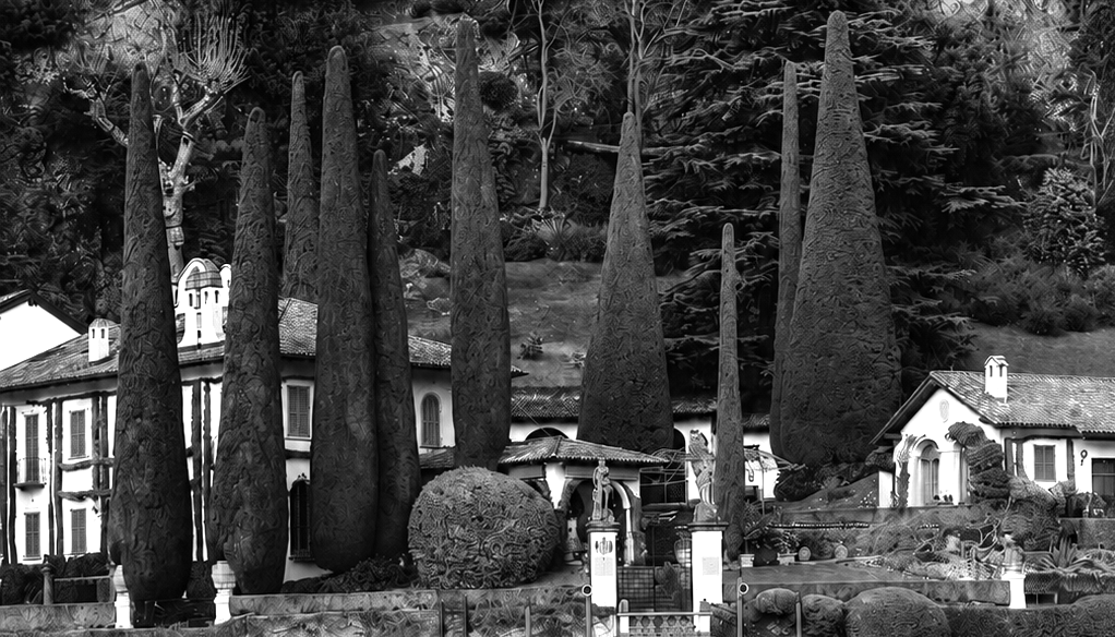 Historic lakeside villa with cypress trees overlooking Lake Como in Italy.