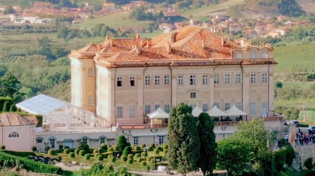 Luxury wedding villa in Tuscany surrounded by vineyards, rolling hills and cinematic Italian countryside views.