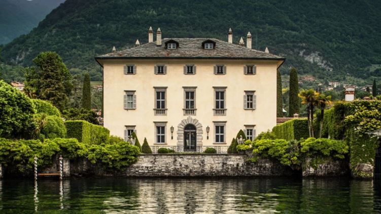 Villa Balbiano on Lake Como surrounded by lush gardens and mountains in Italy