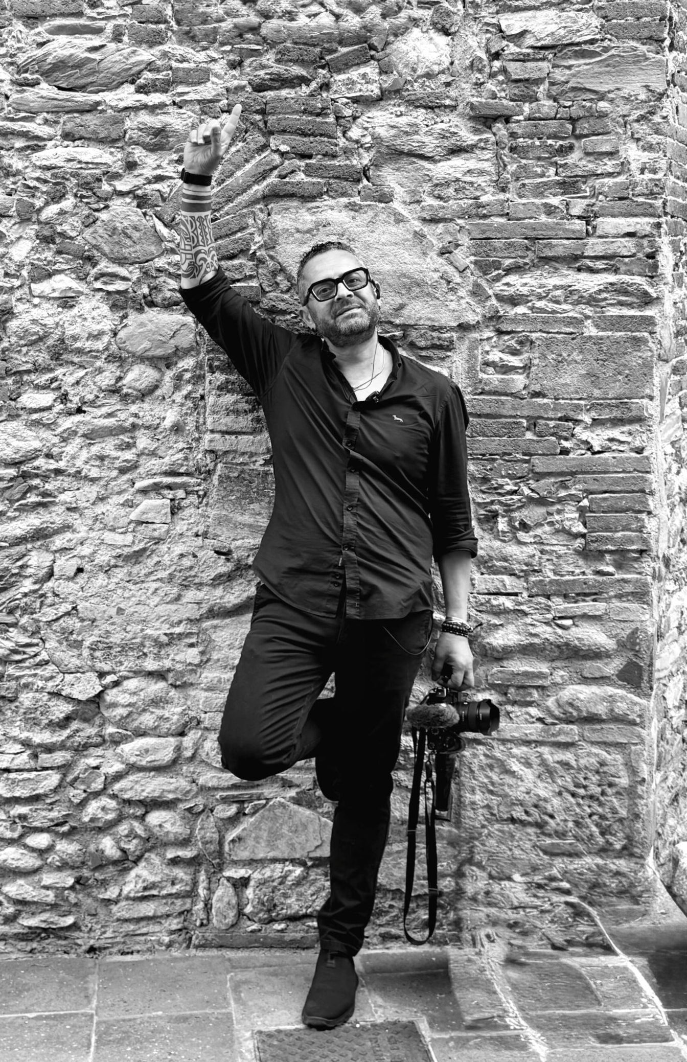 Italy Wedding videographer 7 Destination wedding videographer Italy — Giancarlo De Vita in a cinematic black and white editorial portrait.